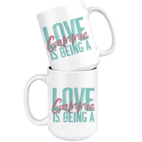 Love is being  a Gammie 15 oz White Coffee Mug