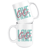 Love is being a Gigi 15 oz White Coffee Mug